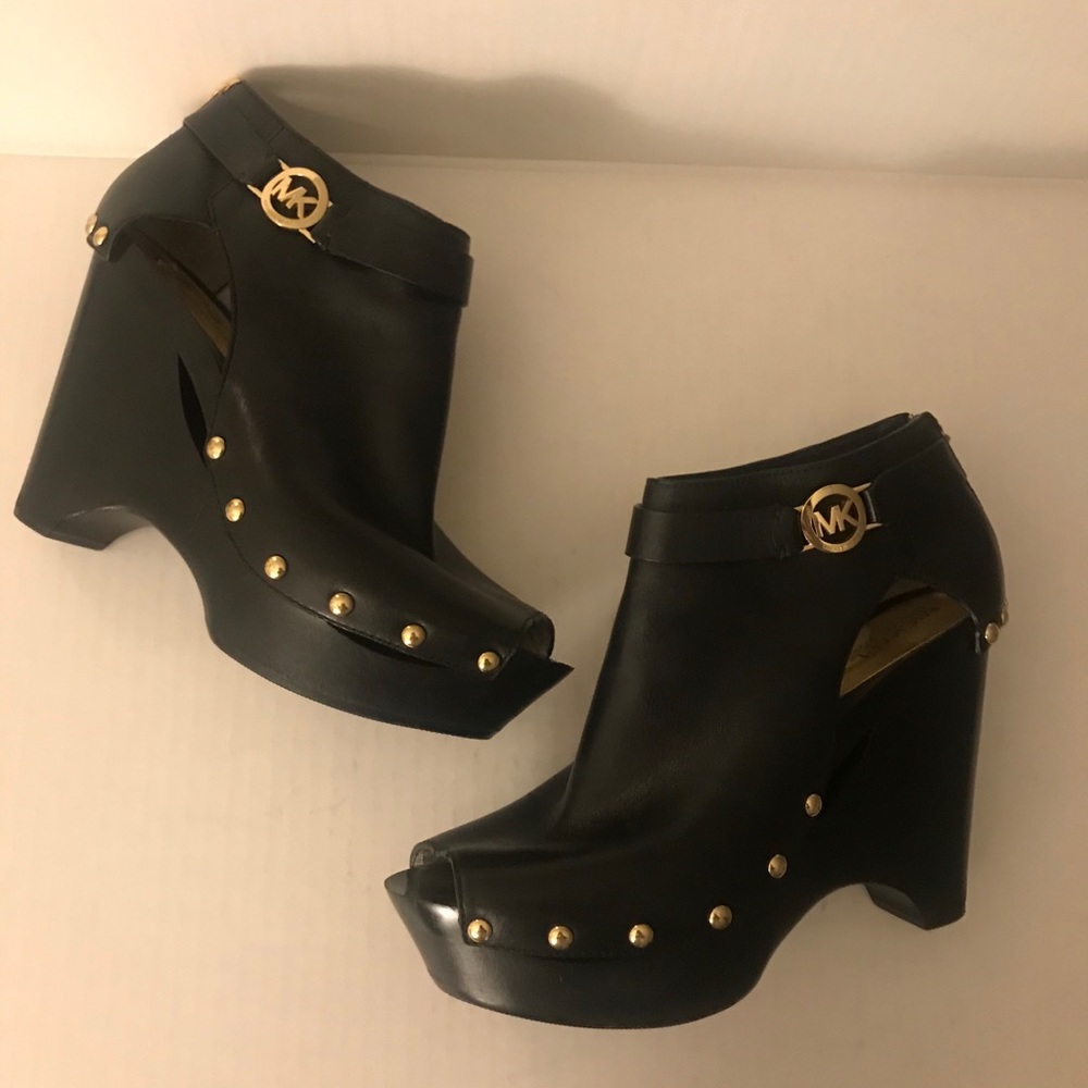 Michael Kors black leather studded platform shoes.